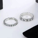 Chrome ring pair, two polished silver bands with engraved markings