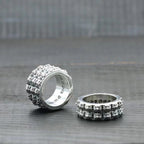 Silver-tone textured band ring set, front and side views, floral cutout design