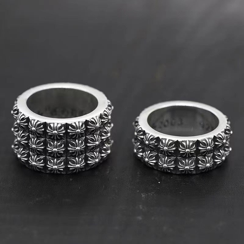 Silver chrome style rings with raised floral pattern, set of two