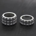 Silver chrome style rings with raised floral pattern, set of two