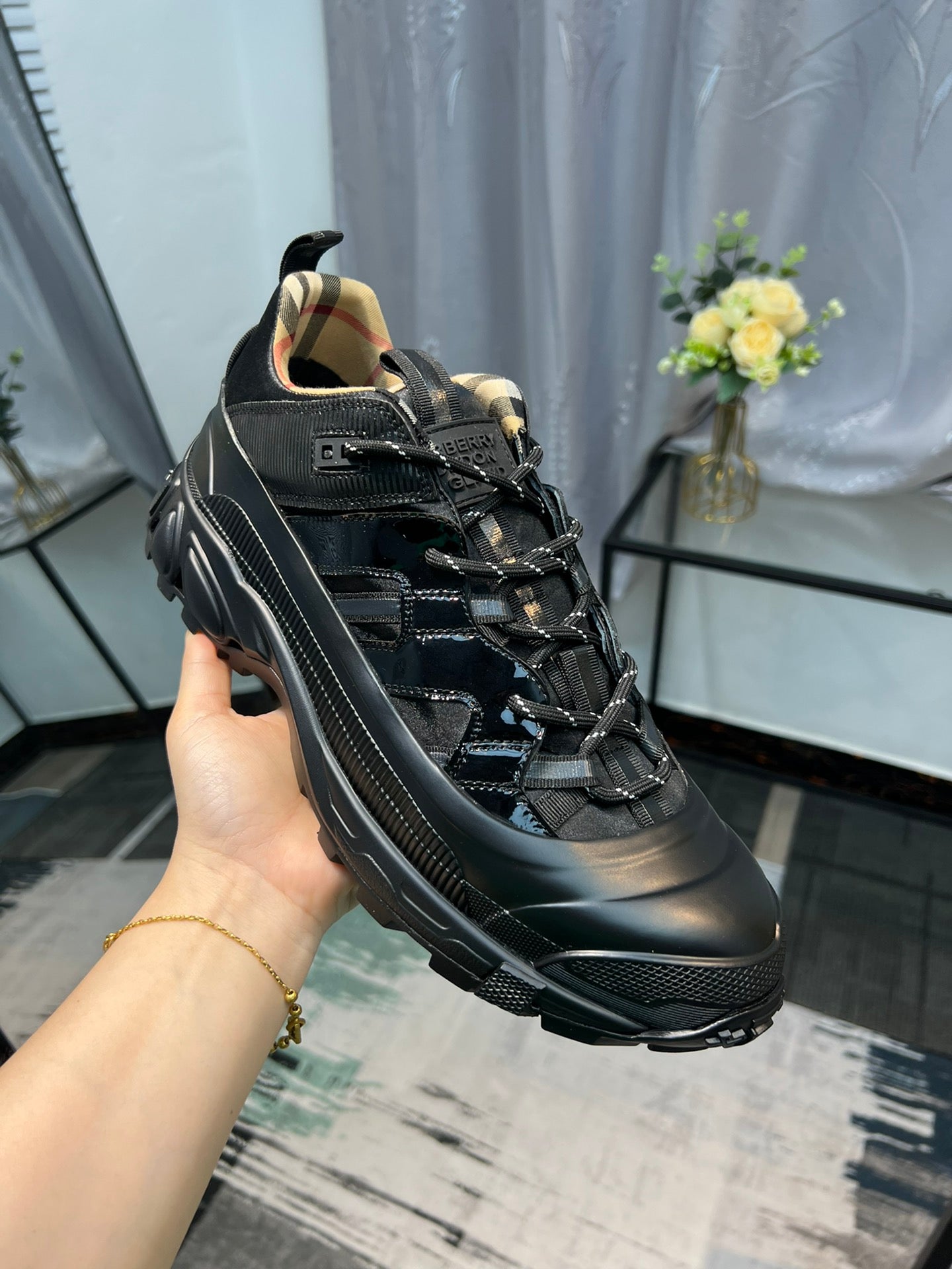 Burberry black running-style sneakers with lace-up closure and rubber sole