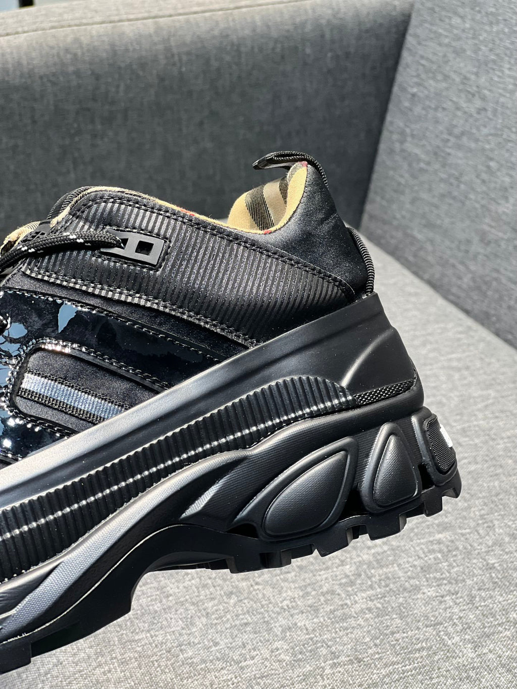 Burberry black sneaker with textured side panel and chunky ridged sole