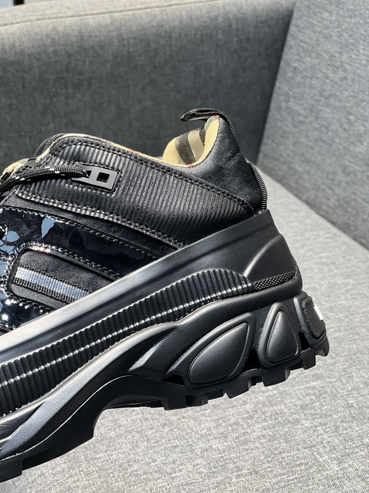 Burberry black sneaker with textured side panel and chunky ridged sole