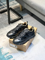 Burberry lace-up sneakers on box, black upper with cushioned collar