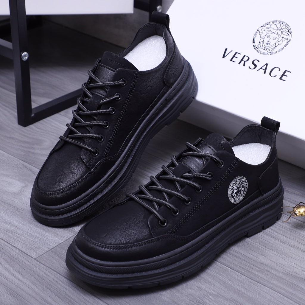 Black lace-up leather sneakers with Medusa logo badge and chunky sole