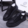 Black lace-up leather sneakers with Medusa logo badge and chunky sole