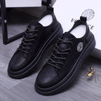 Black lace-up sneakers with Medusa logo on side and chunky platform sole