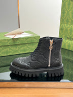 Gucci unisex dark black lace-up boot with side zip and embossed monogram pattern