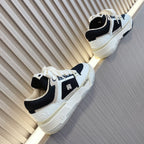 Amiri low-top sneakers with white and black color-block, lace-up, side logo detail