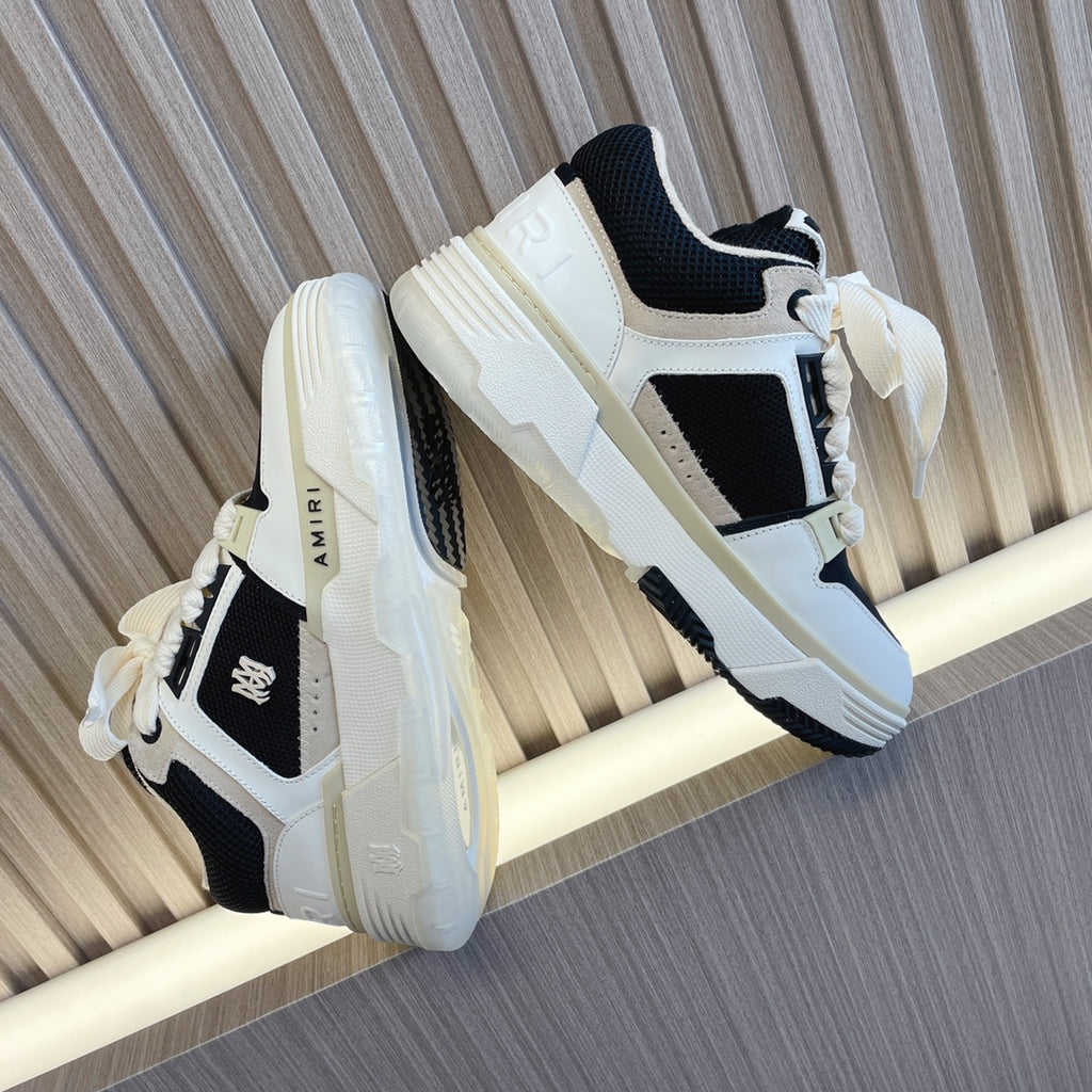 Amiri low-top sneakers, white upper with black accents and chunky white sole, lace-up