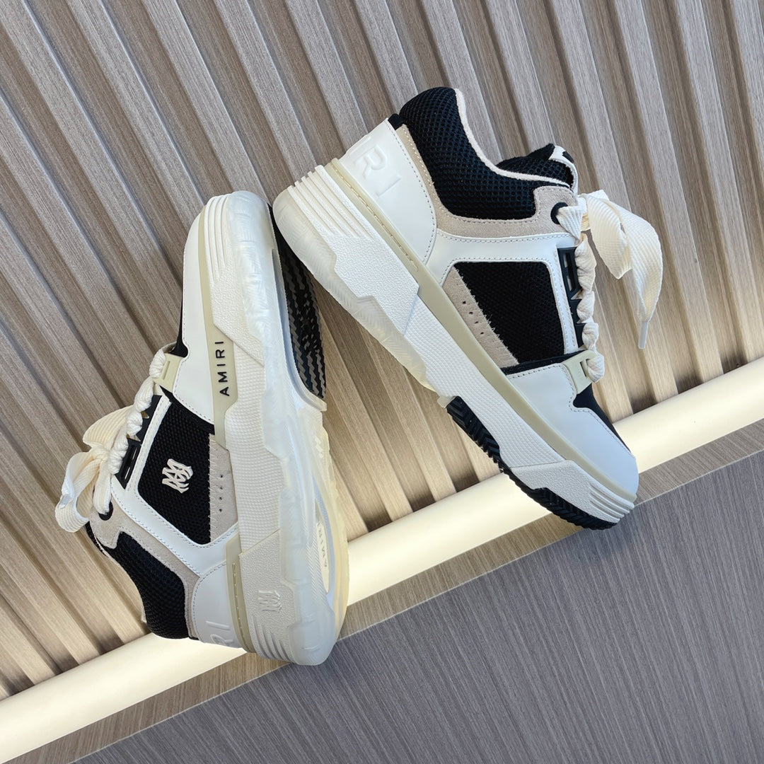 Amiri low-top sneakers, white upper with black accents and chunky white sole, lace-up