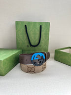 GG monogram belt with brown leather strap and blue interlocking G buckle.