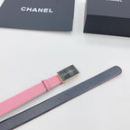 Chanel belt shown laid out, pink strap with dark backing and gold-tone buckle