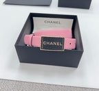 Chanel belt with pink leather strap and black grained buckle with CHANEL logo