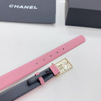 Chanel belt with pink strap and dark backing, gold buckle with CC logo