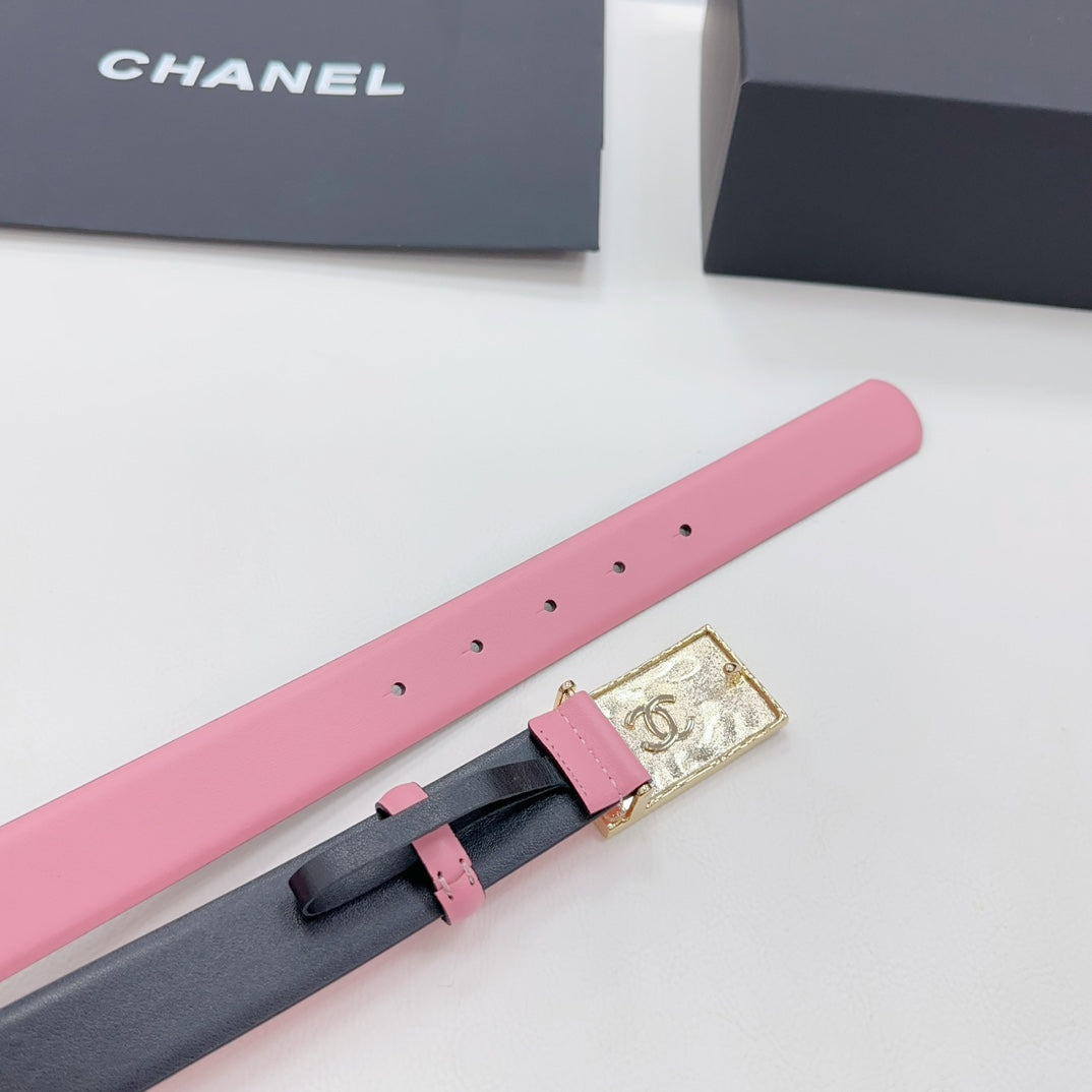Chanel belt with pink strap and dark backing, gold buckle with CC logo