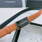 Chanel belt with tan strap and dark green reverse, featuring rectangular logo buckle