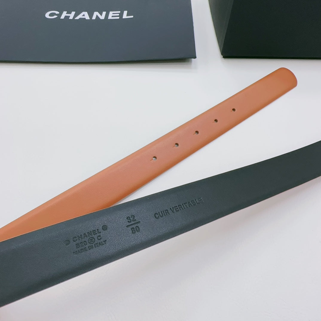 Chanel belt close-up showing tan strap holes and dark green underside branding