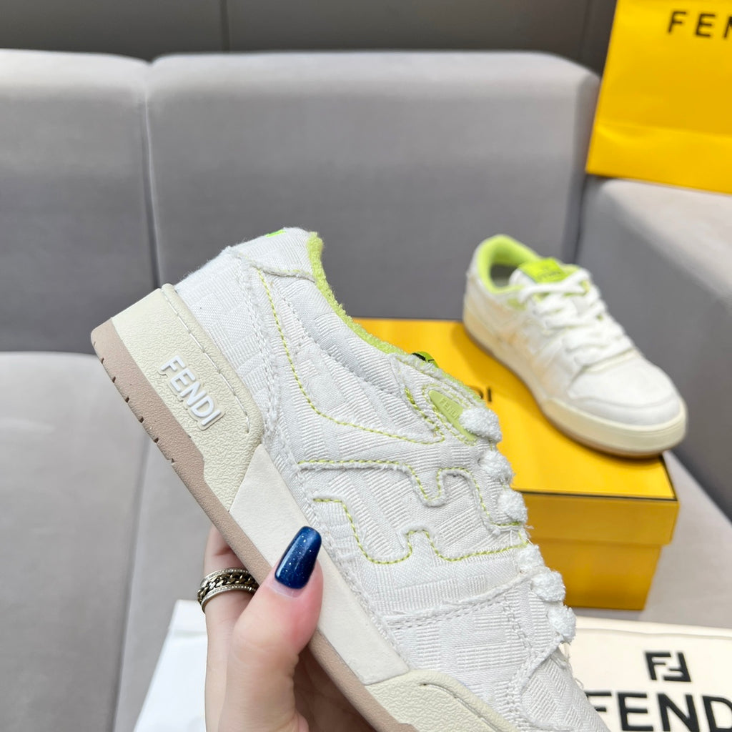White unisex sneakers, side view with textured panels and neon green lining