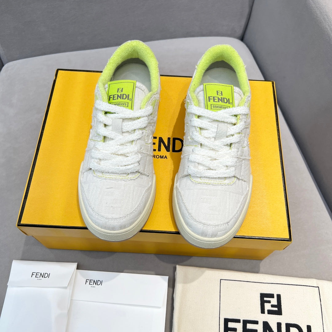 Front view of white unisex sneakers with neon green collars and lace-up design