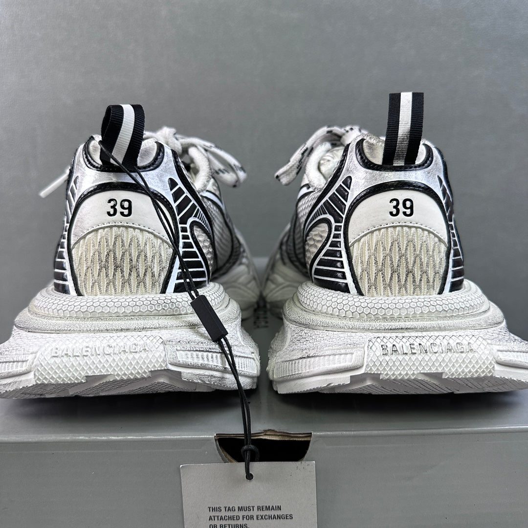 White sneakers with black heel loops and side stripes, showing back and soles