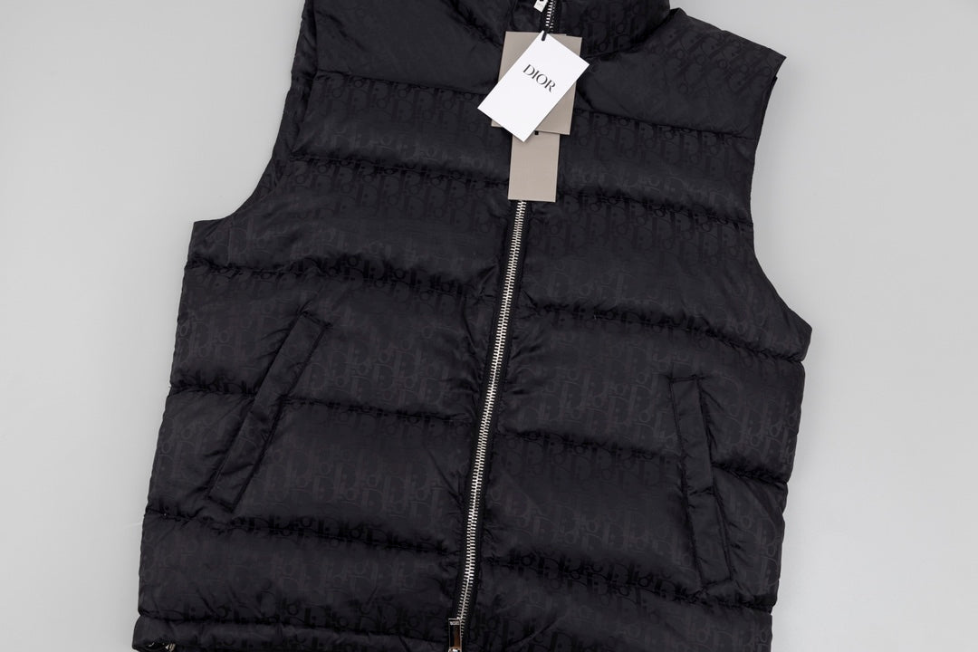 Black hooded puffer vest front, zipper and padded quilting detail