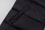Black hooded puffer vest back panel with structured quilting