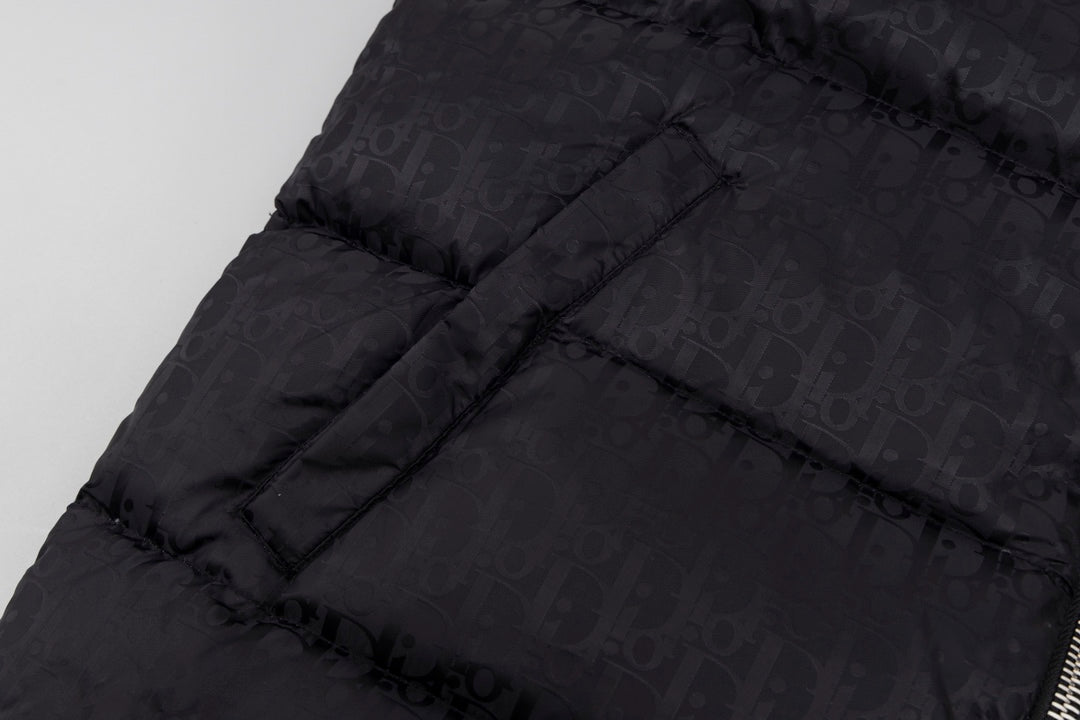 Black hooded puffer vest back panel with structured quilting