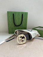 Gucci leather belt with round rhinestone G buckle and canvas strap detail
