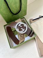 Gucci belt in gift box with brown leather strap and rhinestone circular G buckle