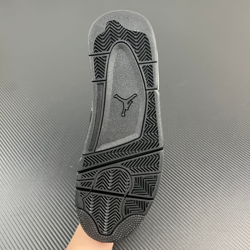 Air Jordan 4 outsole with textured herringbone tread and Jumpman logo.