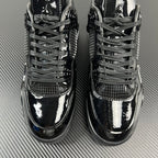 Air Jordan 4 front view with black laces and mesh toe and quarter panels.