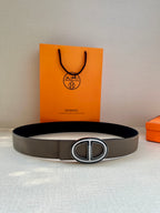 Grey belt with oval interlocking buckle, flat on display