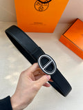 Hermes black leather belt with silver-toned double “H” buckle and textured strap.