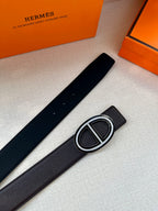 Hermes black leather belt with Double H buckle centered, flat view