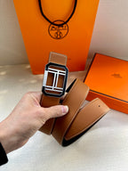 Tan leather belt with silver-tone square H buckle and second belt strap