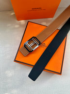 Tan leather belt with black underside and silver-tone square H buckle