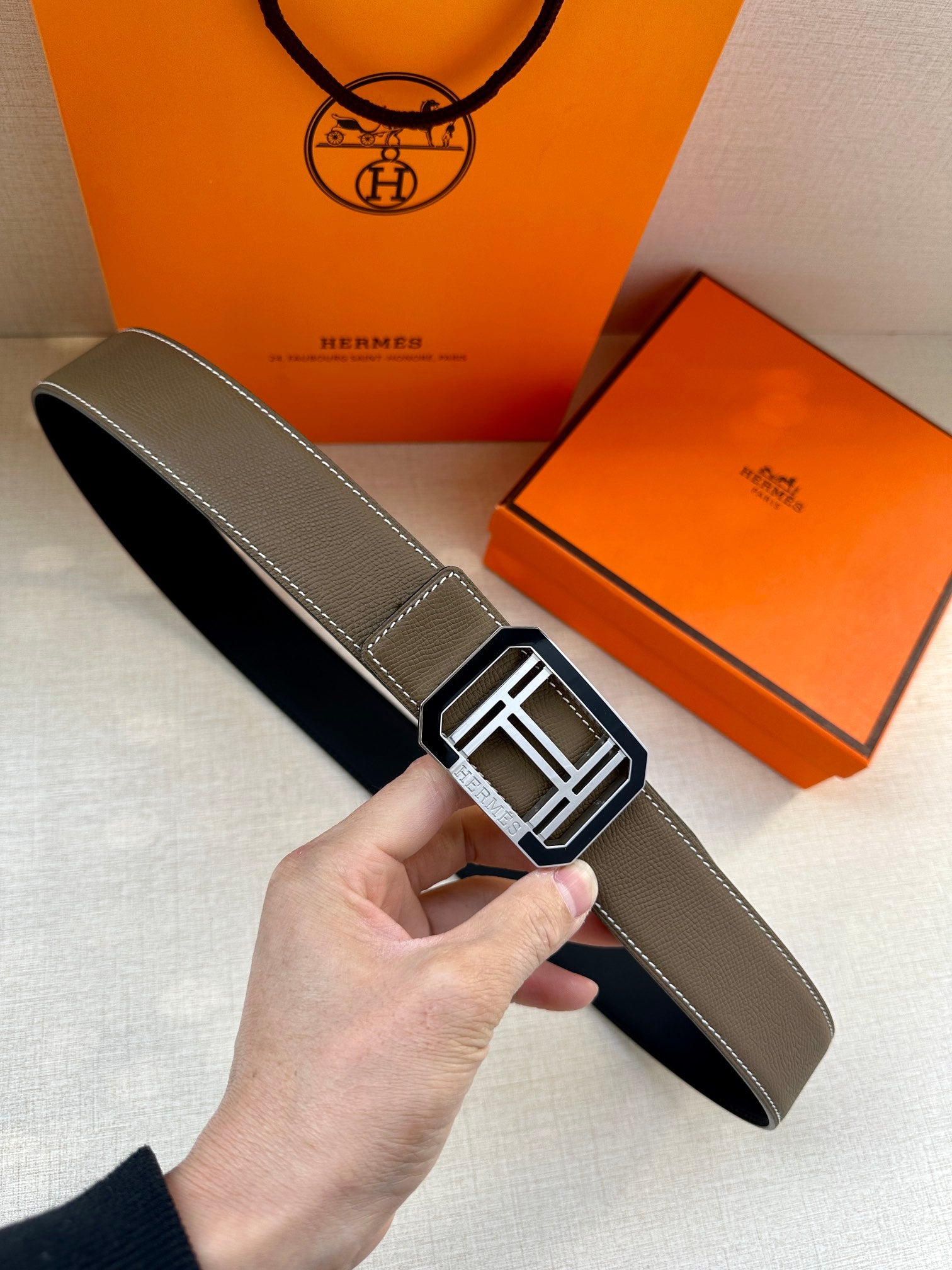 Dark gray leather belt with silver-toned square Hermes buckle
