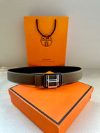 Dark gray leather belt with silver Hermes buckle, full front view