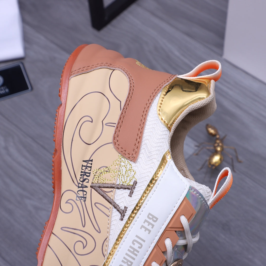 Versace sneaker side view: peach-beige leather panels, white mesh, orange sole edge