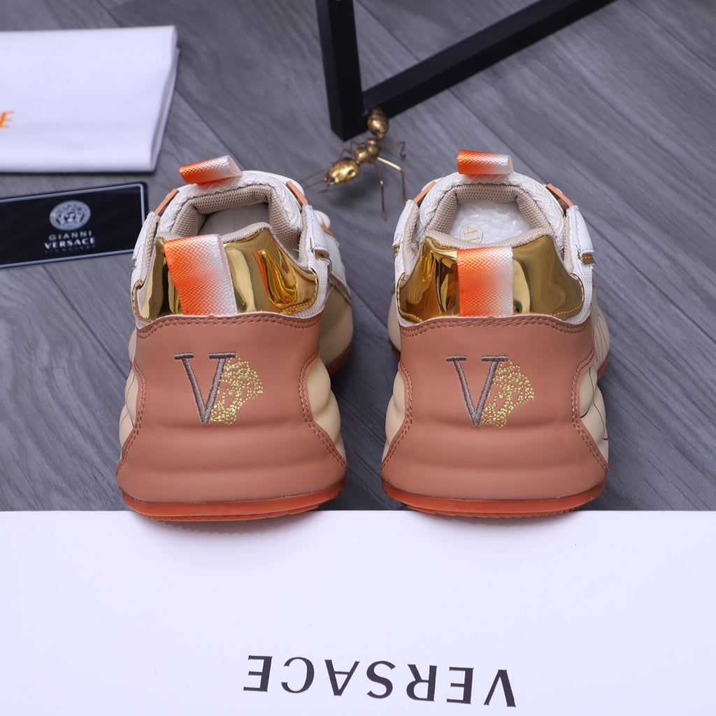Versace sneakers back view: peach-beige leather heel with gold V logo, orange tabs