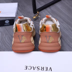 Versace sneakers back view: peach-beige leather heel with gold V logo, orange tabs