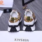 Versace luxury sneakers heel view, gold-and-blue print, white back and black tread soles
