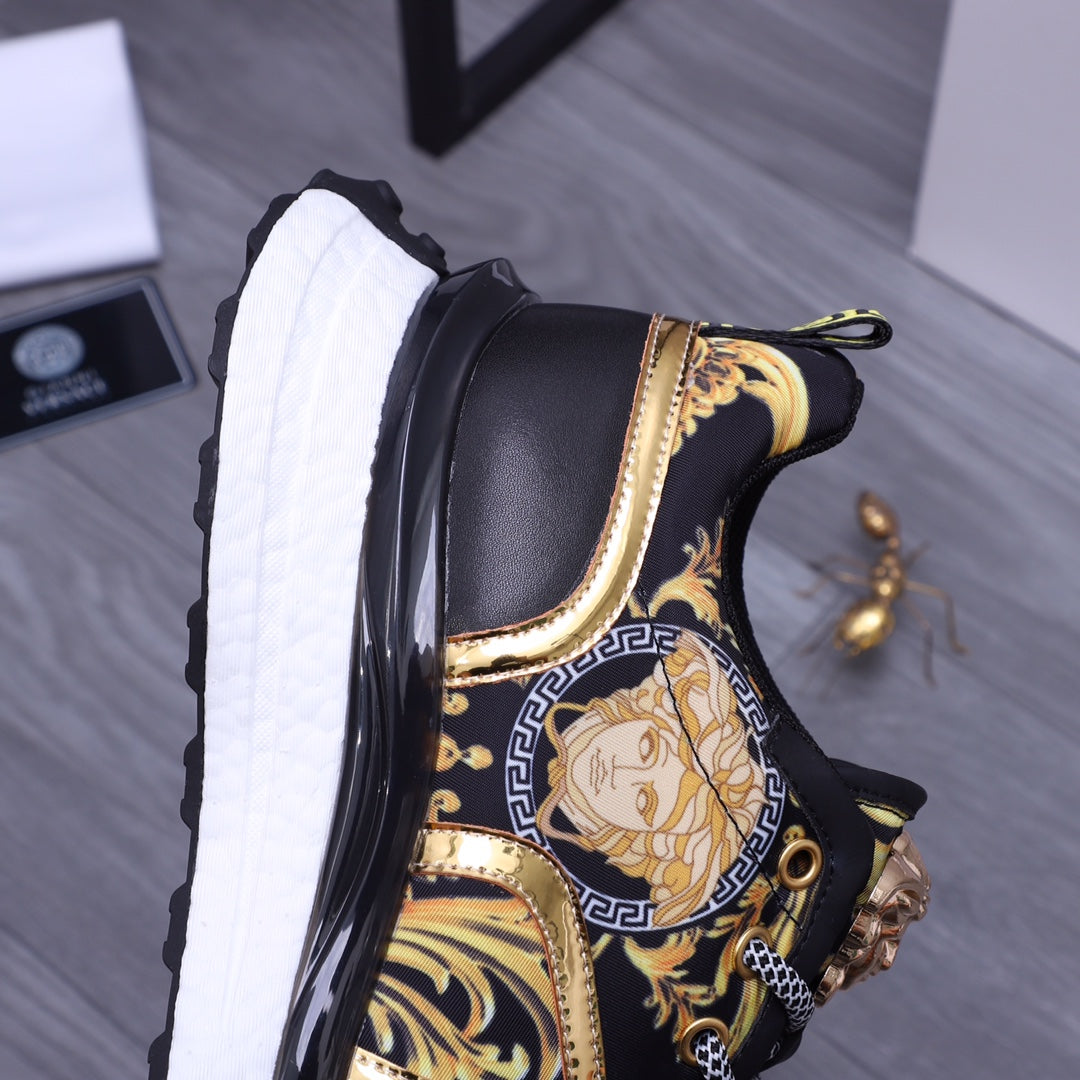 Versace luxury shoes, side view black sneakers with gold trim, Medusa emblem, white textured sole