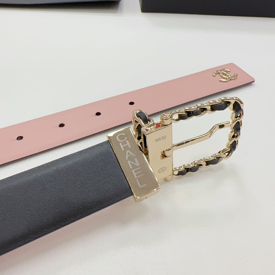 Chanel belt close-up: pink and dark leather straps with gold buckle and chain detail.