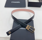 Chanel belt with dark leather strap, Chanel logo, gold buckle with chain-link detail.