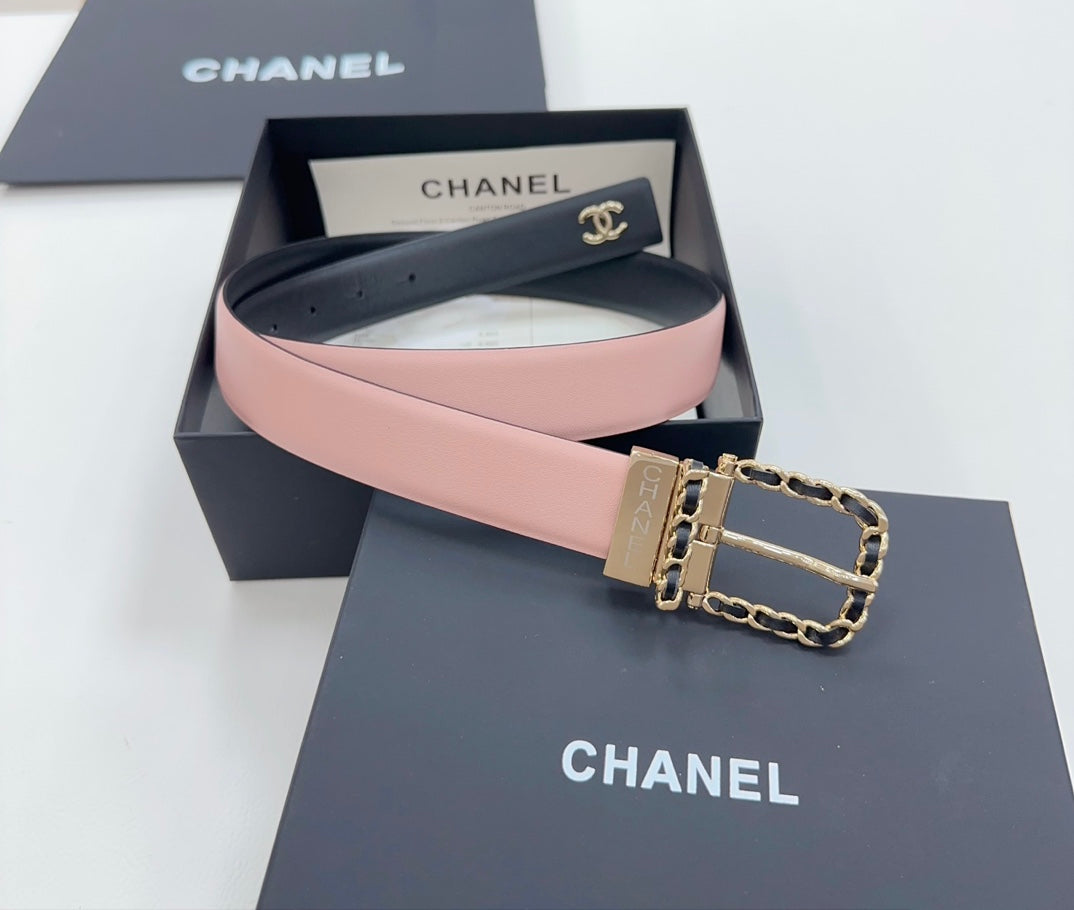Chanel belt with dark leather outer and pink inner strap, gold buckle with chain detail.
