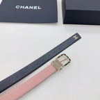 Chanel belt close-up: dark leather strap with Chanel logo plate and gold chain buckle.