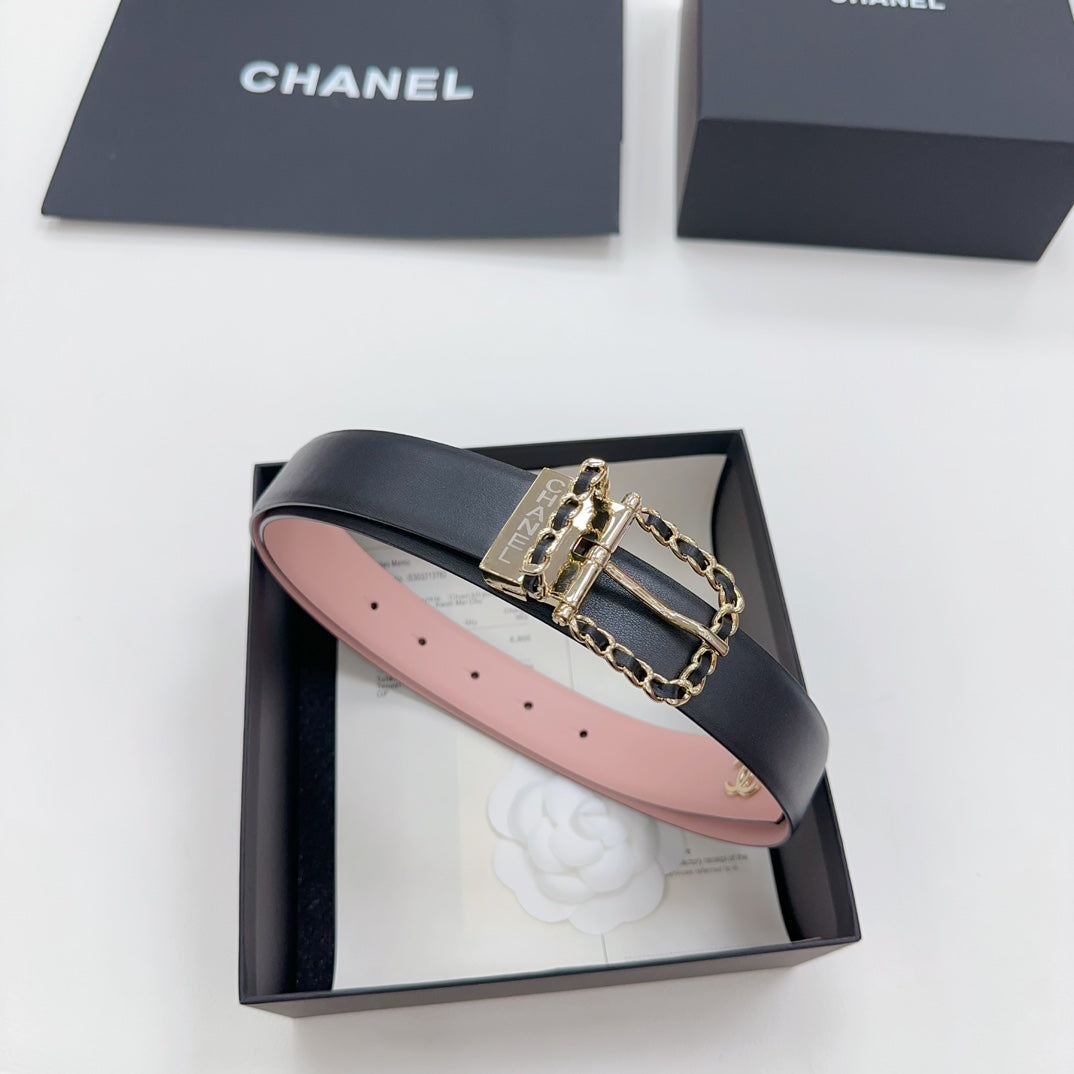 Chanel belt with dark leather strap, gold buckle, and chain-link detail, pink underside.