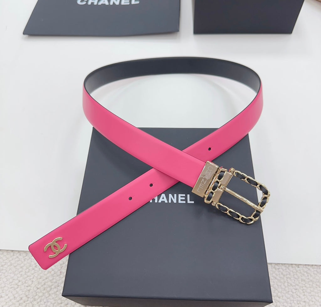 Chanel belt with hot-pink strap detail, navy backing, and gold-tone chain-link buckle.